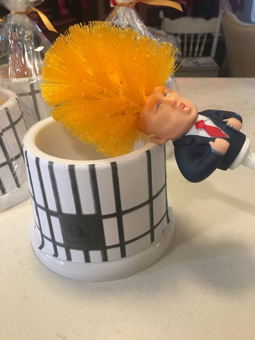 Commander in Crap™ Trump toilet brush with Limited Edition Prison Bar Bucket. When he’s not scrubbing he’s sitting in his cell.